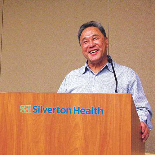 Harry Lee Kwai speaking at a meeeting at Silverton Health